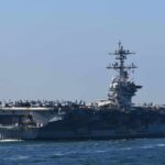 Aircraft carrier cruising at sea