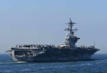 Aircraft carrier cruising at sea