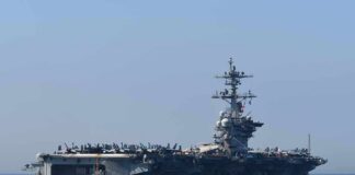 Aircraft carrier cruising at sea