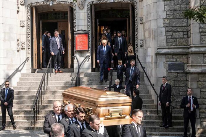 pallbearers carrying a casket down church steps