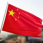Racist Shockwave Hits South China Sea Waving flag of China with a star and four smaller stars