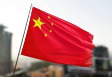 Racist Shockwave Hits South China Sea Waving flag of China with a star and four smaller stars