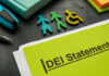 Colorful figures representing gender and accessibility next to a DEI statement document