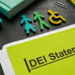 Colorful figures representing gender and accessibility next to a DEI statement document