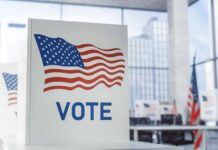 Voting booth with American flag design in a modern polling place