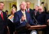 Shock Death Stuns Capitol A group of government officials at a press conference with one speaking into a microphone