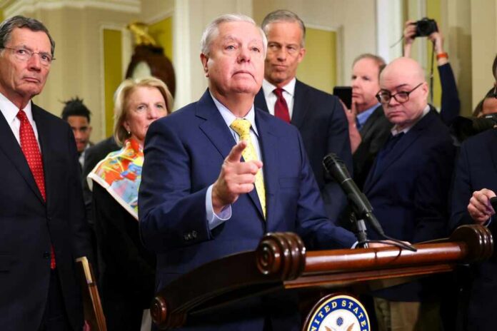 A group of government officials at a press conference with one speaking into a microphone