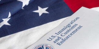 U.S. flag with a document from U.S. Immigration and Customs Enforcement