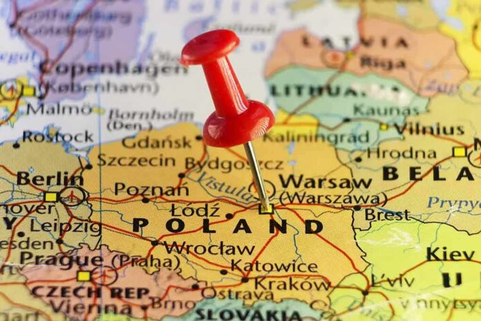 shutterstock_510294343 Red pushpin marking Poland on a European map