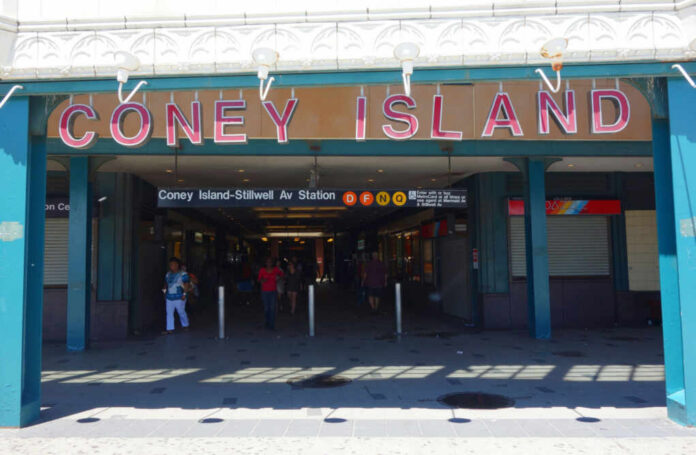 shutterstock_664437622 Entrance to Coney Island subway station with people walking