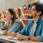 Students listening in a university lecture hall