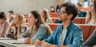 Students listening in a university lecture hall