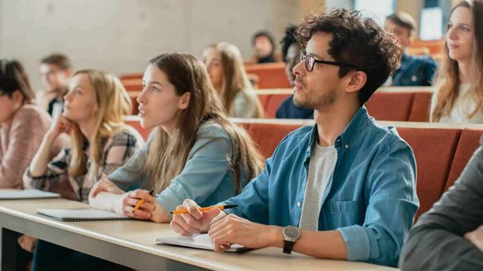 Students listening in a university lecture hall