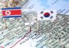 Map of Korean Peninsula with North and South Korean flags and handshake icon