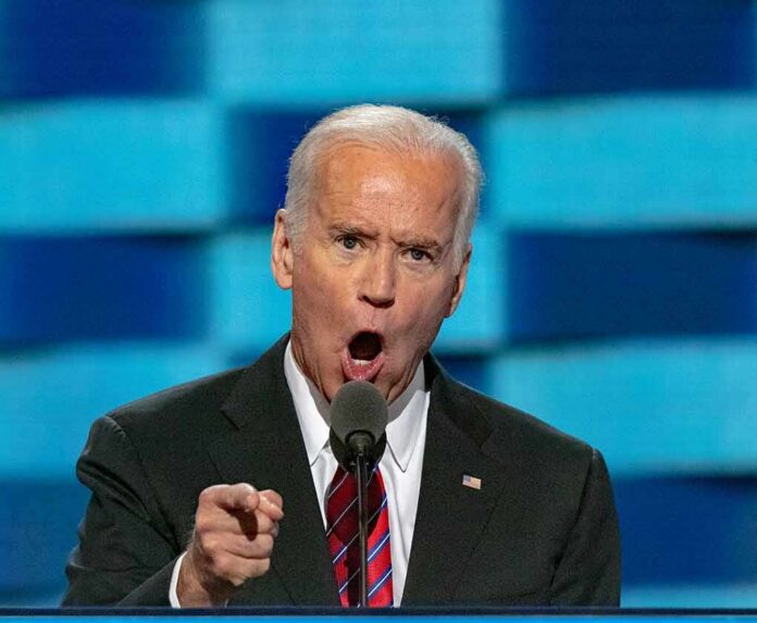 man in suit speaking passionately at a podium