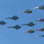 A formation of military jet fighters flying in a clear blue sky
