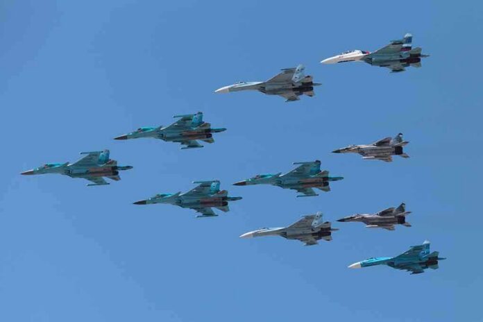 A formation of military jet fighters flying in a clear blue sky