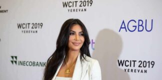 woman in white suit on event red carpet