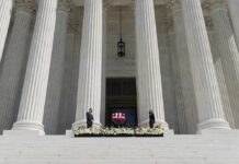 Congress Targets Reporter Over Iran Trip Flag-draped casket on courthouse steps between towering columns