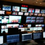 control room with multiple screens and monitors