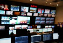 control room with multiple screens and monitors