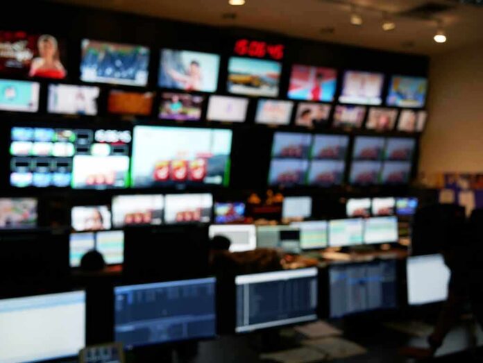 control room with multiple screens and monitors