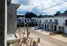 Row of newly built townhouses on a construction site