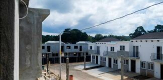 Row of newly built townhouses on a construction site