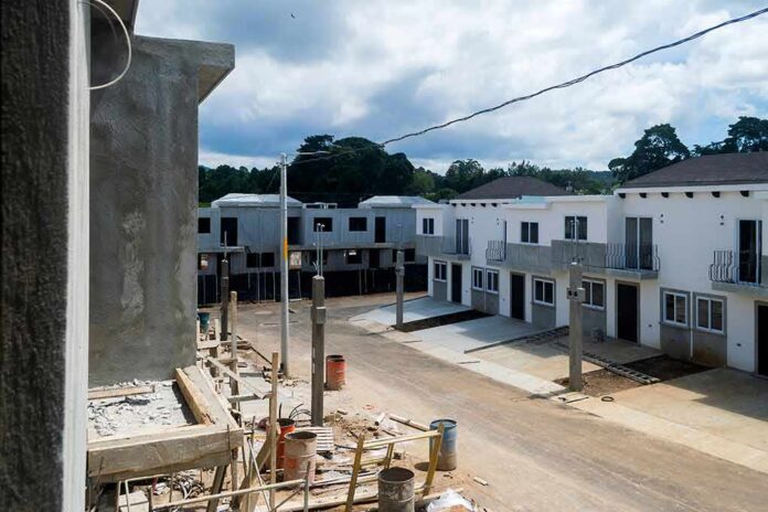 Row of newly built townhouses on a construction site