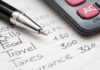 Budget list with pen and calculator