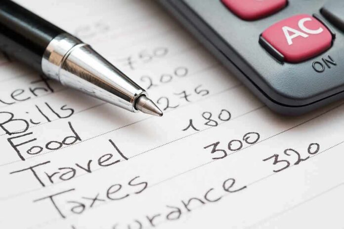 shutterstock_471795281-4 Budget list with pen and calculator