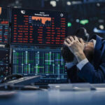 Trillionaire Shock: Musk Breaks Money Reality Trader stressed out by multiple declining stock charts.