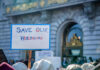 Sign reading Save Our Healthcare at protest.