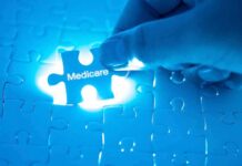 Hand placing a puzzle piece labeled Medicare
