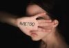 woman covering face with hand showing message