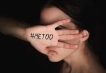 woman covering face with hand showing message