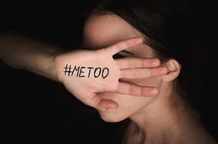 woman covering face with hand showing message