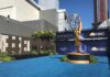 Emmy Awards outdoor setup with large statue and blue carpet