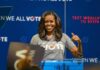 woman speaking at a podium during a voting event