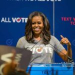 woman speaking at a podium during a voting event