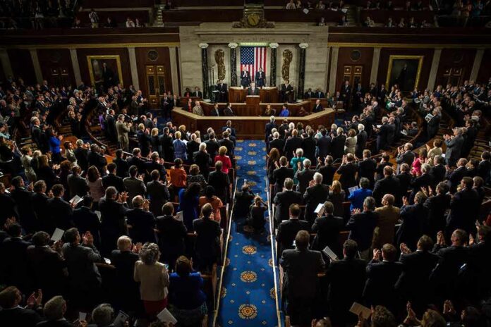 Legislative chamber audience stands and applauds