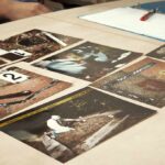 Crime scene photos laid out on a desk