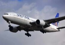 Commercial airliner approaching landing with landing gear down