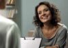 Smiling woman talking during a meeting