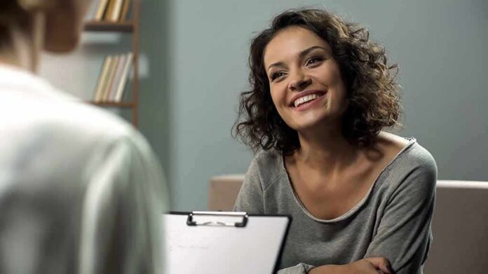 Smiling woman talking during a meeting