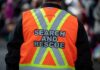 Search and rescue worker in orange reflective vest
