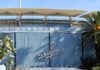 Dodger Stadium exterior with blue corrugated wall and palm trees