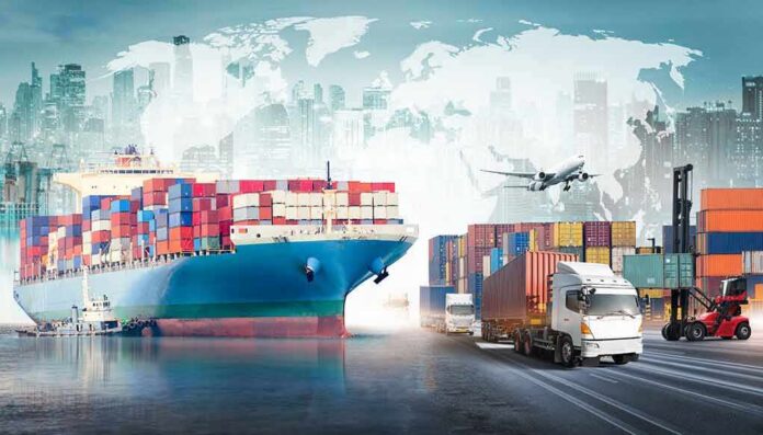 Cargo ship with containers alongside trucks, plane, and forklifts at a port