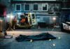 crime scene with body bag in alley