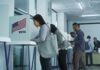 Voters at polling booths in a modern voting center
